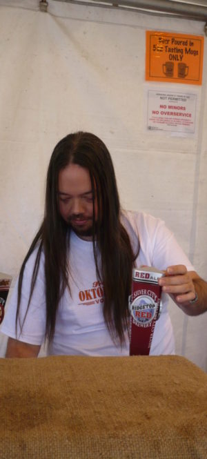 Guy pouring beer at Fremont Oktoberfest