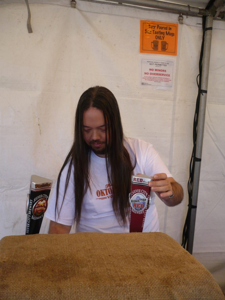 Guy pouring beer at Fremont Oktoberfest