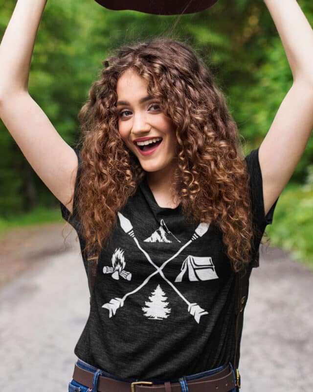 girl wearing a PNW crossed arrows black t-shirt