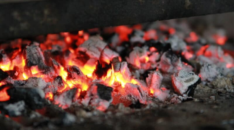 perfect coals for roasting a hot dog over a campfire