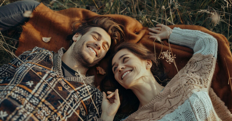 couple camping on a wool blanket
