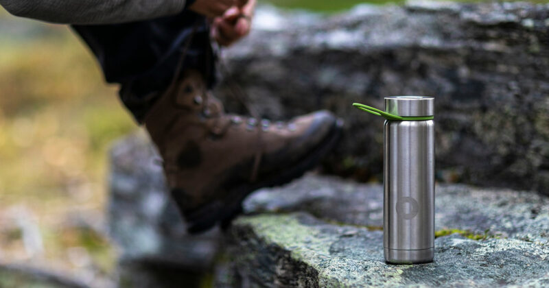 Stainless steel water bottle out for a hike